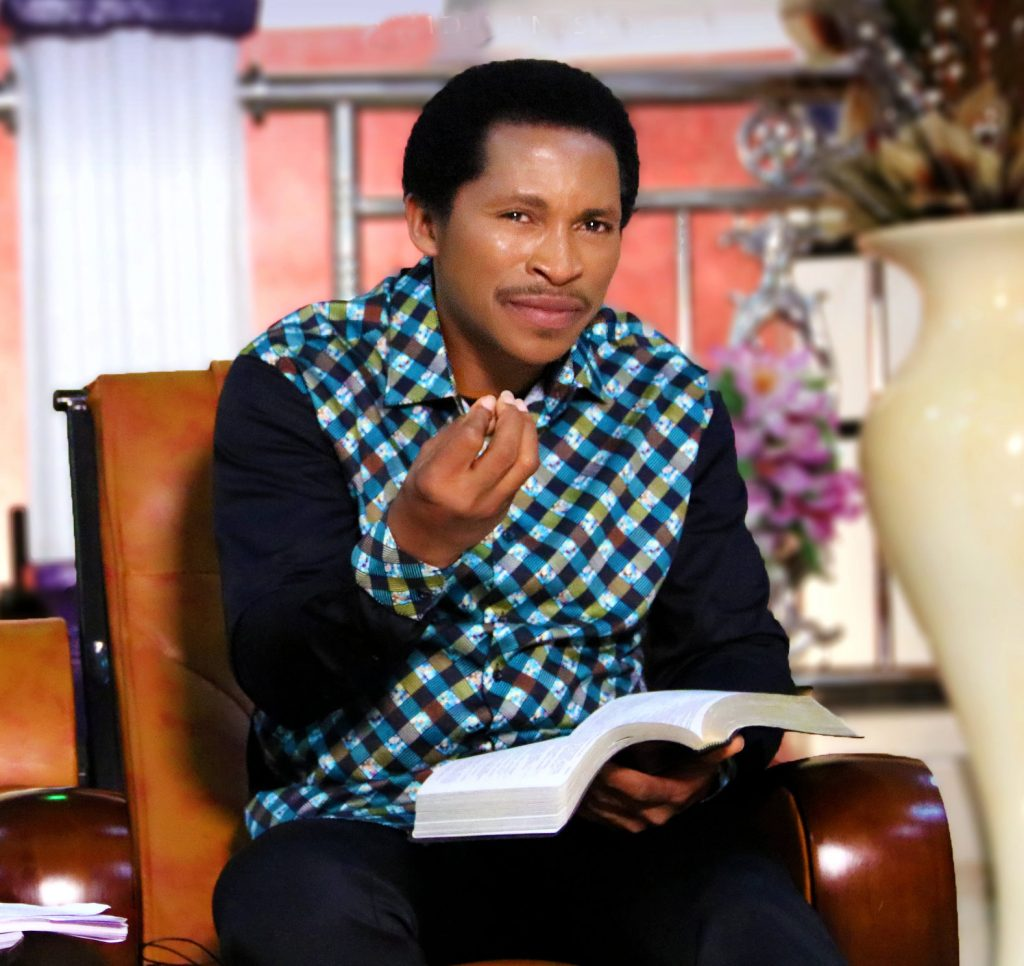 Man sitting while holding bible