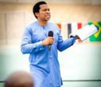 a man speaks to a gathered audience