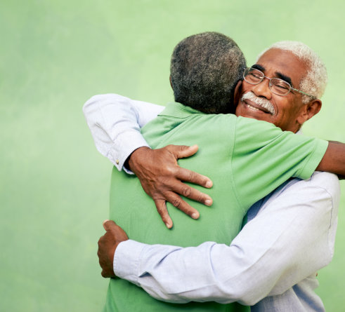 Two men hugging outdoors
