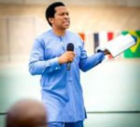 a man speaks to a gathered audience