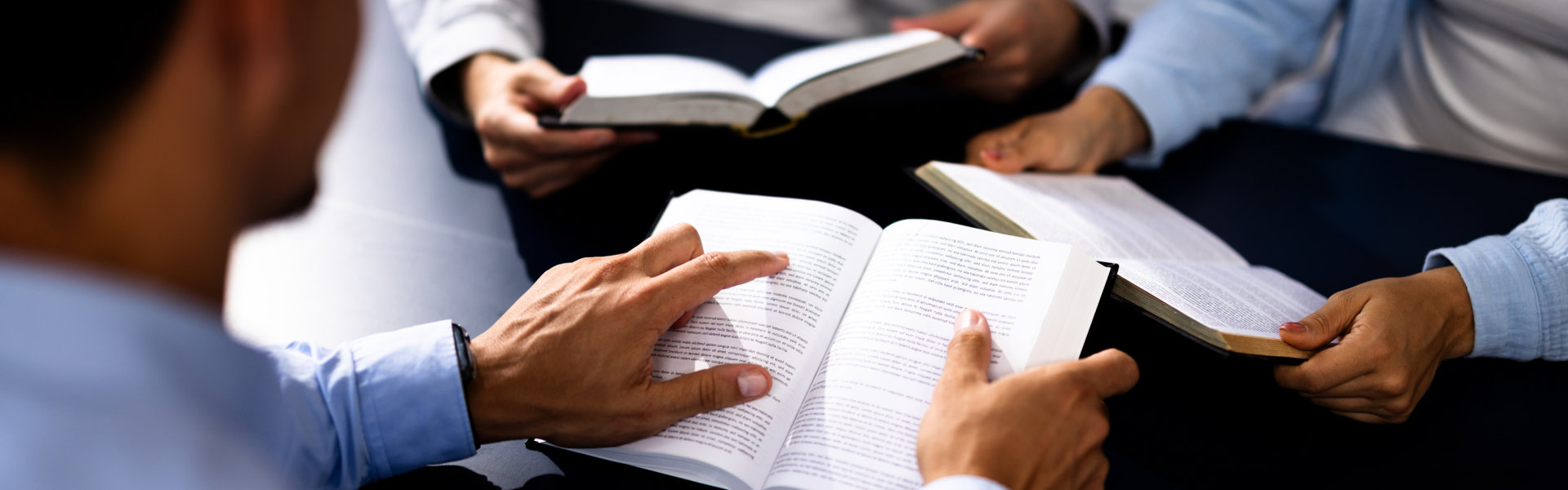 Christian Preacher Reading Holy Bible With Friends in Study Circles