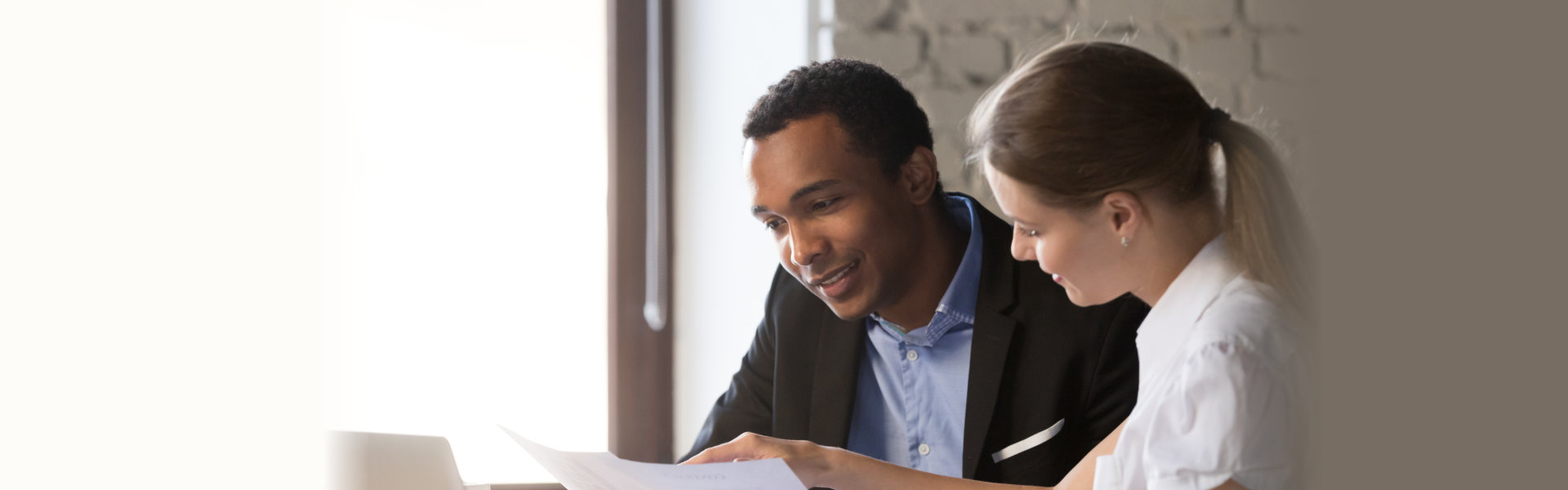 Female financial advisor insurer banker consulting male african american client about contract